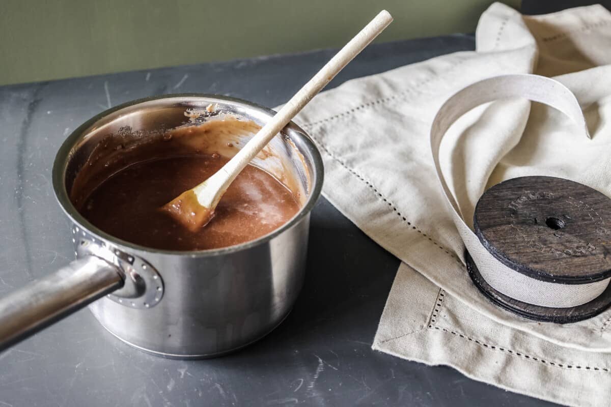 A pot of popular frugal gravy from a packet sits on the stove ready to be served.